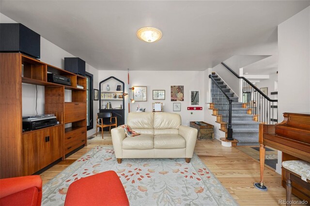 1579 W Costilla Pl, Littleton, CO 80120 - living area featuring stairway and light wood-type flooring