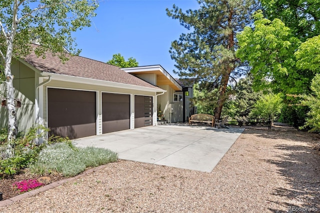 1579 W Costilla Pl, Littleton, CO 80120 - view of side of home with concrete driveway and roof with shingles