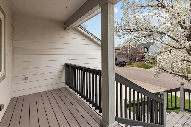 wooden deck with a residential view