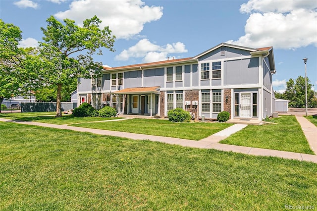 12020 E Canal Dr, Aurora, CO 80011 - view of front of property with a front lawn and brick siding