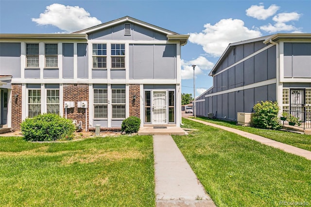 12020 E Canal Dr, Aurora, CO 80011 - view of front of house featuring brick siding and a front yard