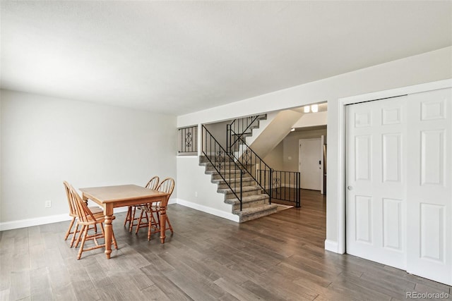 12020 E Canal Dr, Aurora, CO 80011 - dining space with dark wood finished floors, baseboards, and stairs