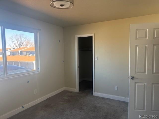12020 E Canal Dr, Aurora, CO 80011 - unfurnished bedroom with carpet flooring, baseboards, and a closet