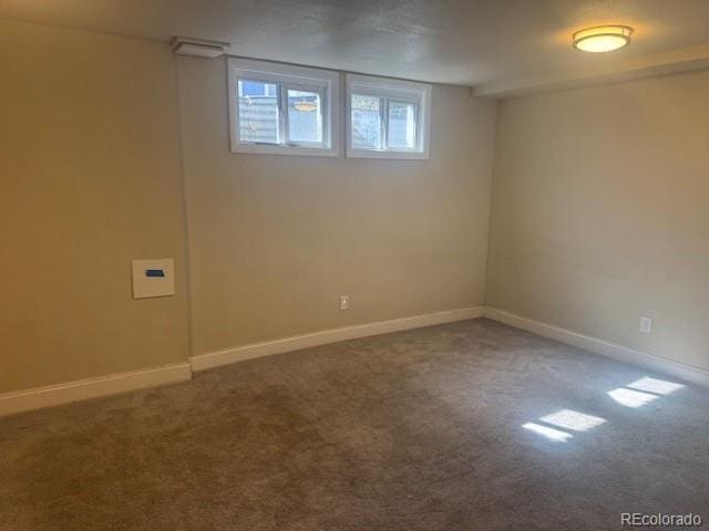 12020 E Canal Dr, Aurora, CO 80011 - below grade area with carpet flooring and baseboards