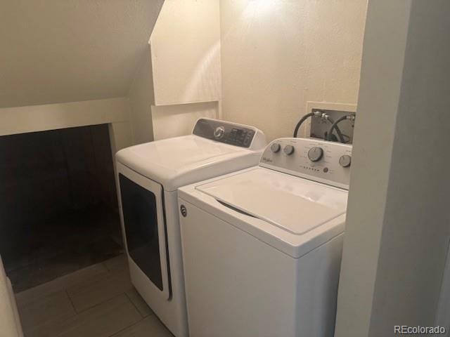 12020 E Canal Dr, Aurora, CO 80011 - washroom with separate washer and dryer and tile patterned flooring