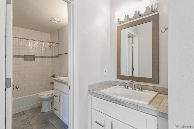 12020 E Canal Dr, Aurora, CO 80011 - bathroom with vanity, toilet, tile patterned flooring, shower / bath combo, and a textured ceiling