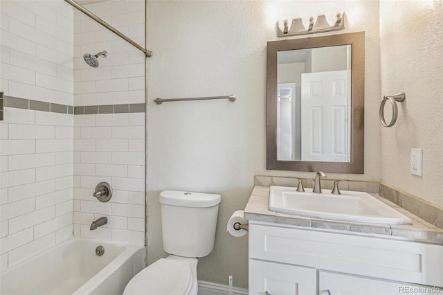 12020 E Canal Dr, Aurora, CO 80011 - full bathroom with toilet, vanity, washtub / shower combination, and a textured wall