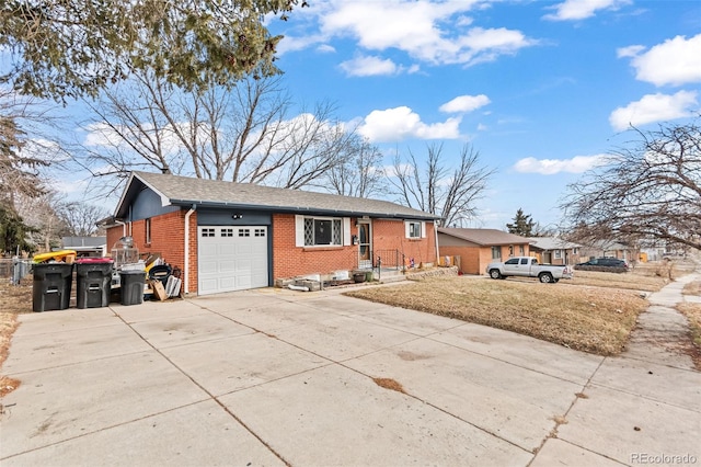 ranch-style house with an attached garage, driveway, and brick siding