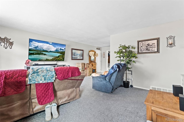 living room featuring carpet, visible vents, and baseboards