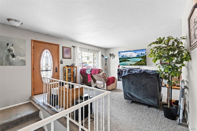 foyer entrance featuring light carpet and baseboards