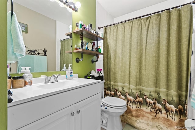 bathroom with vanity and toilet