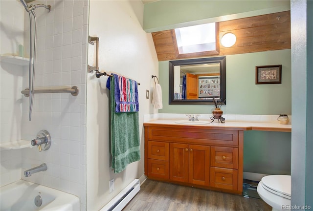 full bathroom featuring vanity, bathing tub / shower combination, vaulted ceiling, baseboard heating, and hardwood / wood-style floors