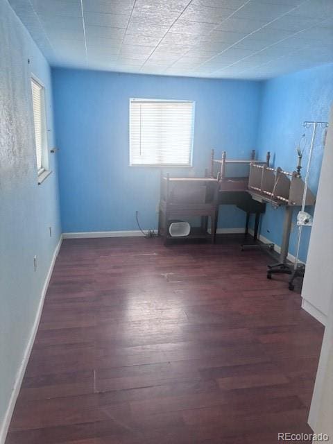310 E Strong Ave, Trinidad, CO 81082 - home office with wood finished floors and healthy amount of natural light