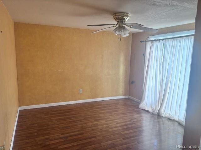 310 E Strong Ave, Trinidad, CO 81082 - spare room featuring a ceiling fan, wood finished floors, a textured wall, and plenty of natural light