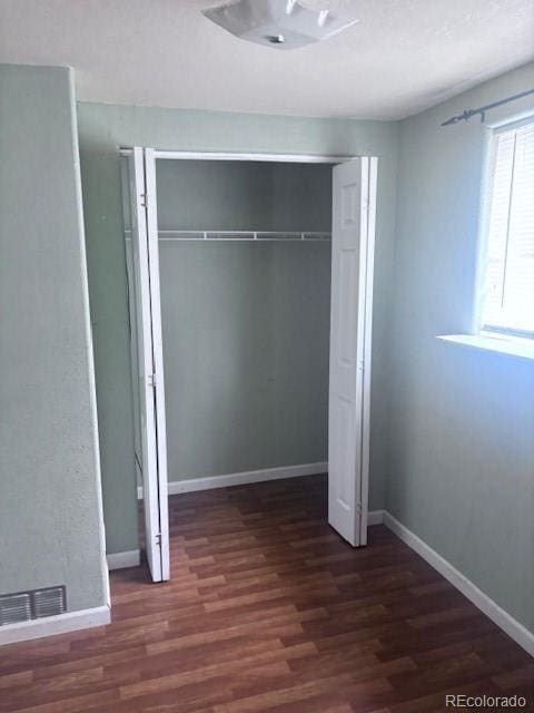 310 E Strong Ave, Trinidad, CO 81082 - unfurnished bedroom featuring wood finished floors and a closet