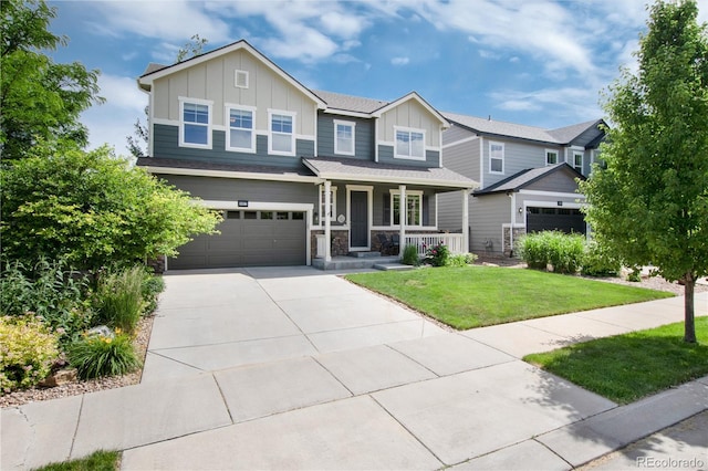 3027 Walnut Grove St, Erie, CO 80516 - craftsman-style house with board and batten siding, covered porch, a front yard, an attached garage, and concrete driveway