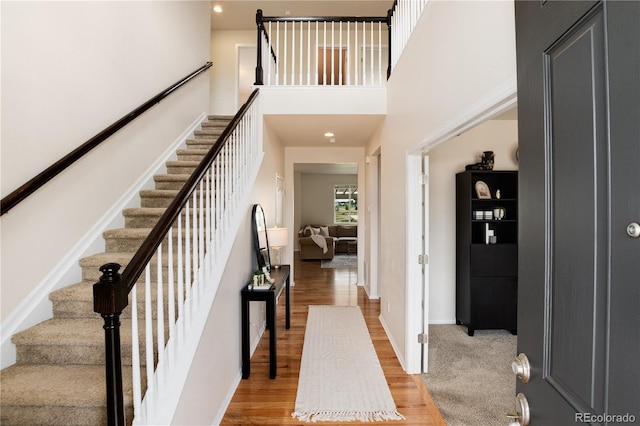 3027 Walnut Grove St, Erie, CO 80516 - entryway with stairway, wood finished floors, and a high ceiling