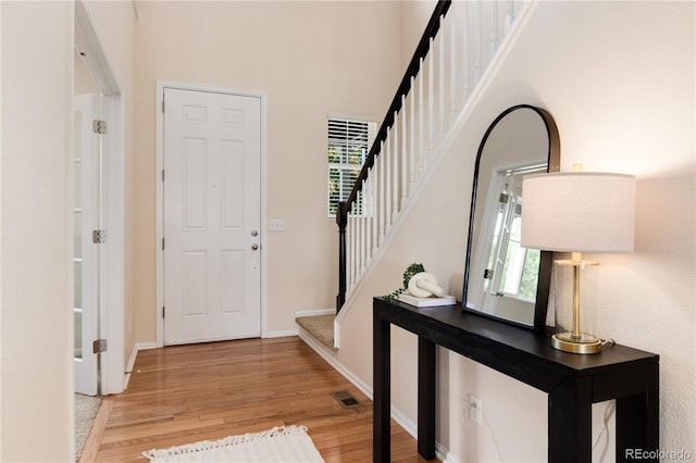 3027 Walnut Grove St, Erie, CO 80516 - foyer featuring wood finished floors, stairs, and a towering ceiling