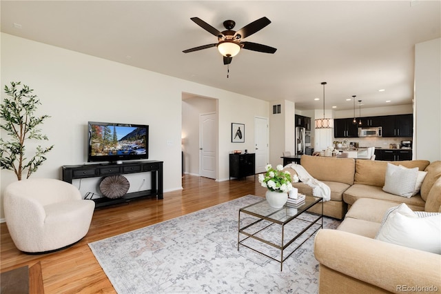 3027 Walnut Grove St, Erie, CO 80516 - living room featuring wood finished floors, ceiling fan, and recessed lighting