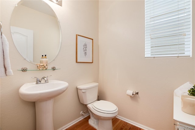 3027 Walnut Grove St, Erie, CO 80516 - half bath featuring toilet and wood finished floors
