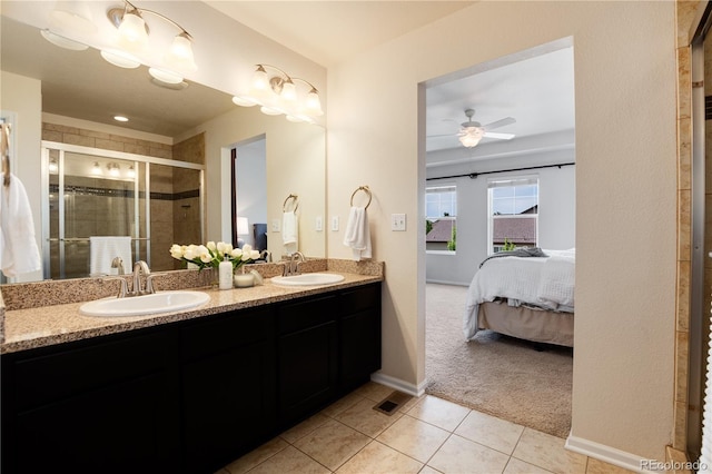 3027 Walnut Grove St, Erie, CO 80516 - full bath featuring ensuite bath, double vanity, tile patterned floors, a shower stall, and ceiling fan