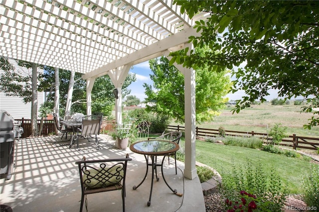 3027 Walnut Grove St, Erie, CO 80516 - fenced backyard featuring a pergola, outdoor dining space, and a patio area