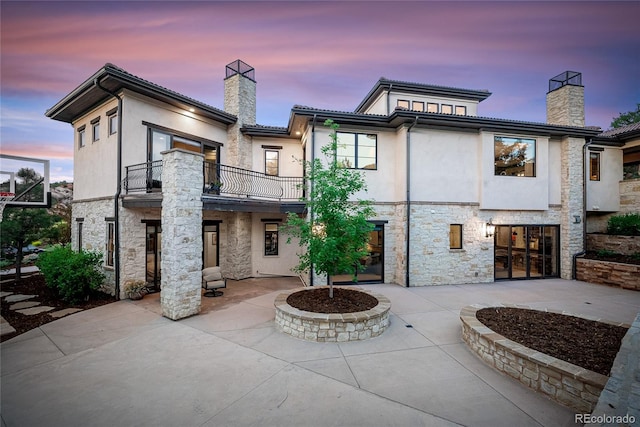 exterior space featuring a balcony and a patio area