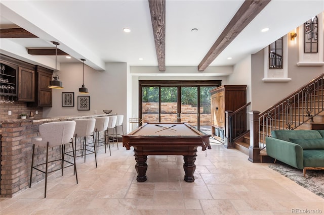 playroom with pool table, bar, and beam ceiling