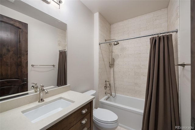 full bathroom featuring shower / bath combo, vanity, and toilet