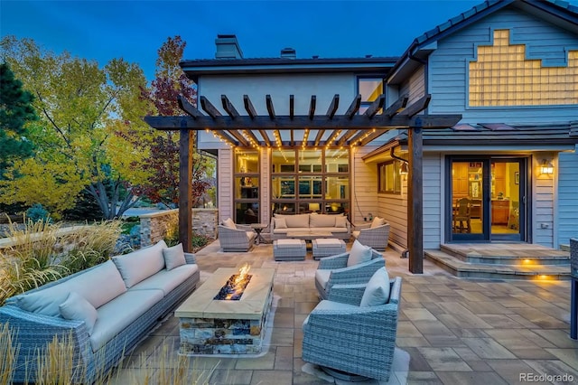 view of patio featuring a pergola and an outdoor living space with a fire pit