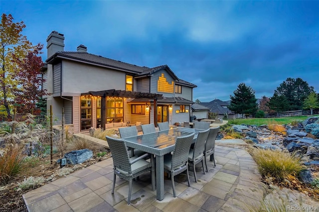 rear view of property featuring a patio