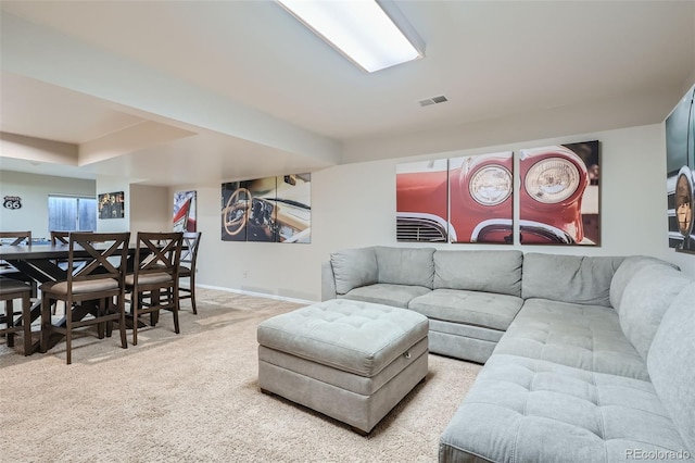 living room featuring light carpet