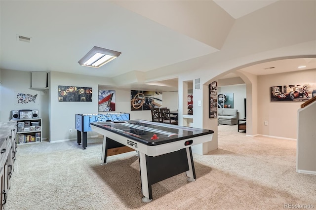 game room with light colored carpet