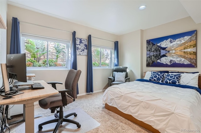 carpeted bedroom featuring multiple windows