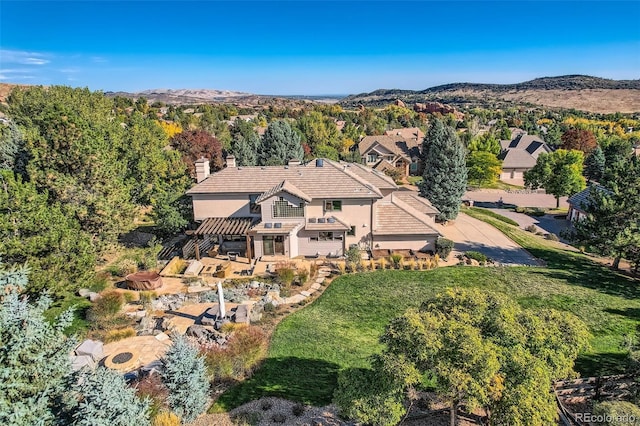 birds eye view of property featuring a mountain view