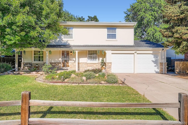 2514 S Elkhart St, Aurora, CO 80014 - traditional home with stucco siding, a porch, driveway, stone siding, and an attached garage