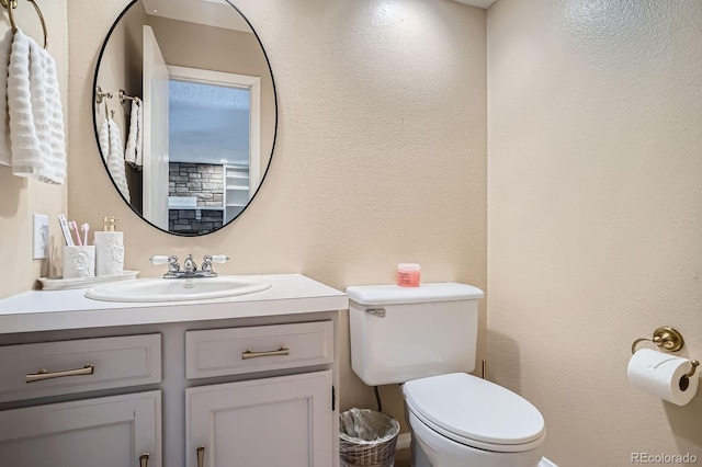 2514 S Elkhart St, Aurora, CO 80014 - bathroom with vanity and a textured wall
