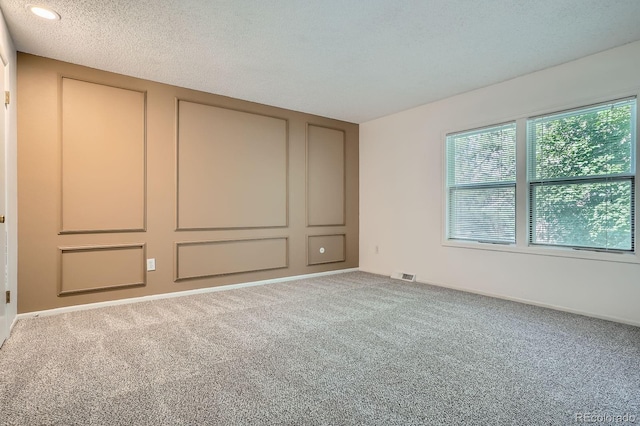 2514 S Elkhart St, Aurora, CO 80014 - unfurnished bedroom with carpet floors, recessed lighting, and a textured ceiling