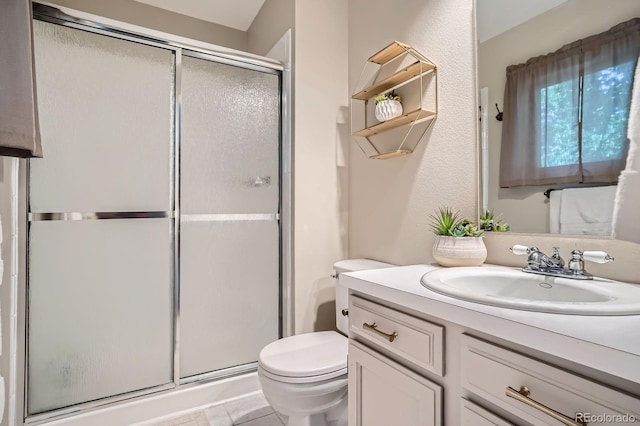2514 S Elkhart St, Aurora, CO 80014 - full bathroom featuring a shower stall, vanity, and tile patterned flooring