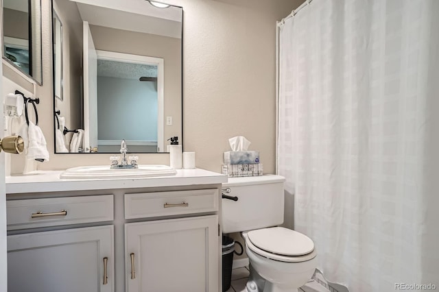 2514 S Elkhart St, Aurora, CO 80014 - bathroom featuring vanity and curtained shower
