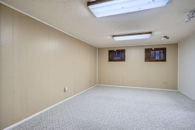2514 S Elkhart St, Aurora, CO 80014 - finished below grade area featuring a textured ceiling and carpet