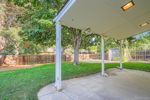 2514 S Elkhart St, Aurora, CO 80014 - fenced backyard with a patio area and a storage shed
