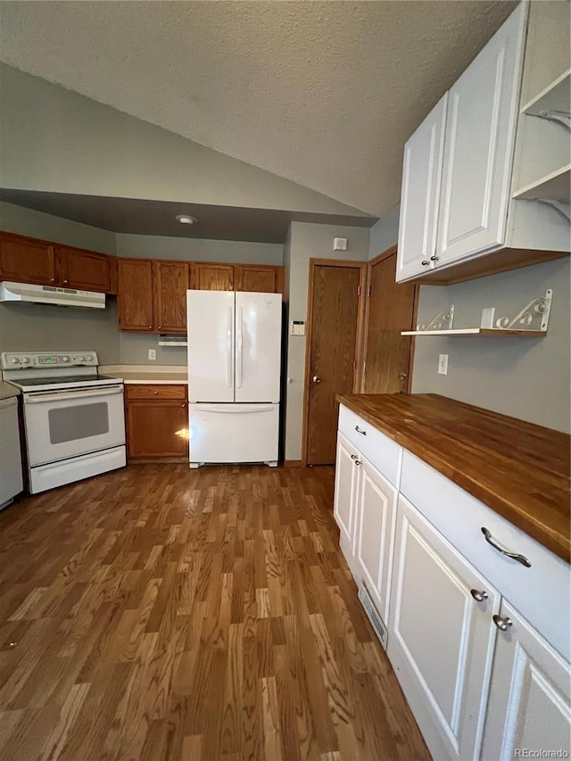 kitchen featuring white appliances, light hardwood / wood-style floors, white cabinets, wood counters, and vaulted ceiling