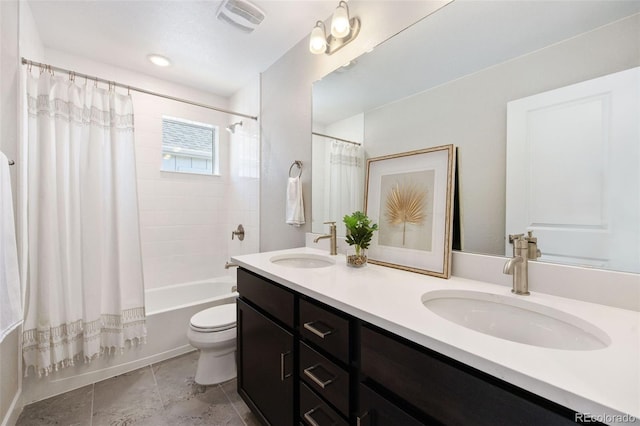 bathroom with shower / bath combo with shower curtain, toilet, double vanity, and tile patterned floors