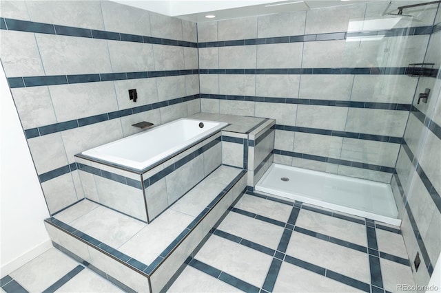 7255 E Quincy Ave Unit 205, Denver, CO 80237 - bathroom with a shower stall, a garden tub, and tile patterned floors