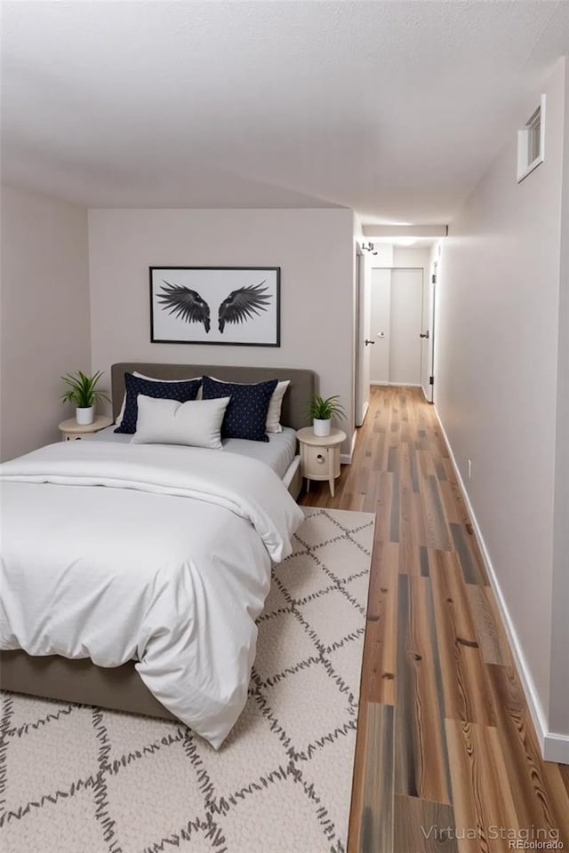 7255 E Quincy Ave Unit 205, Denver, CO 80237 - bedroom featuring light wood-style flooring