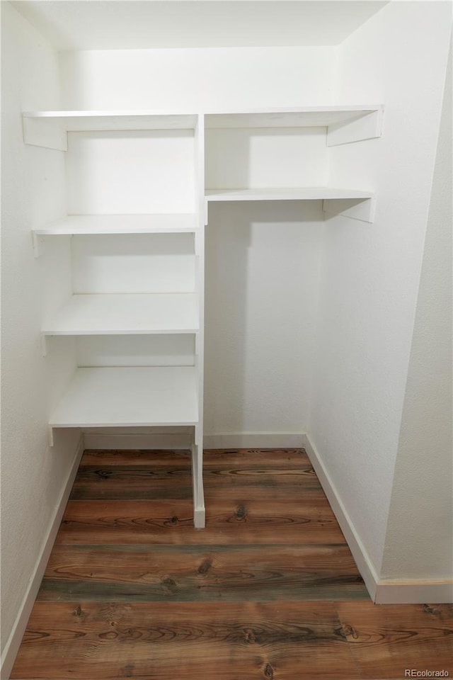 7255 E Quincy Ave Unit 205, Denver, CO 80237 - spacious closet featuring wood finished floors