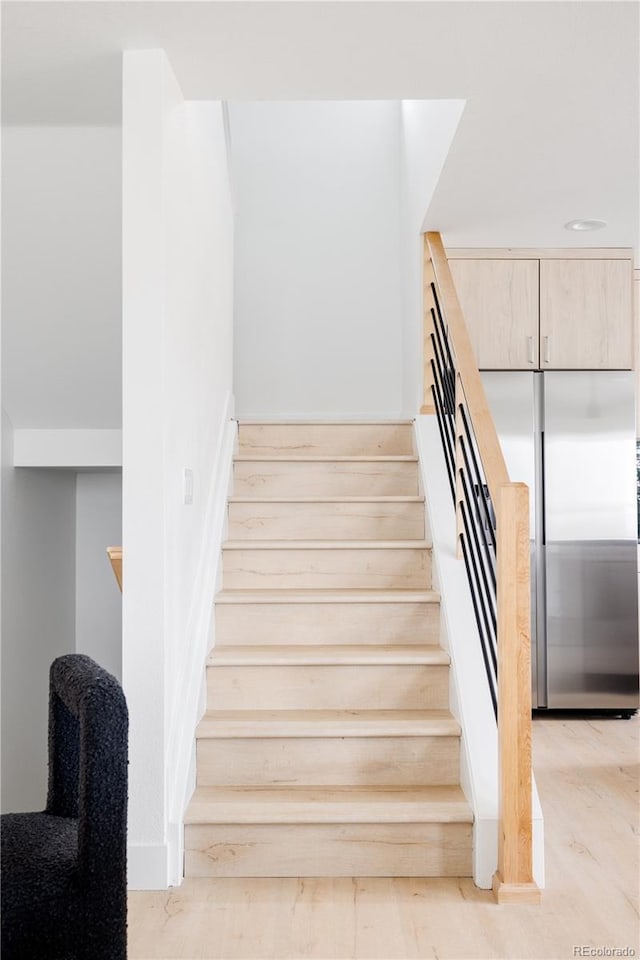 stairs with wood finished floors