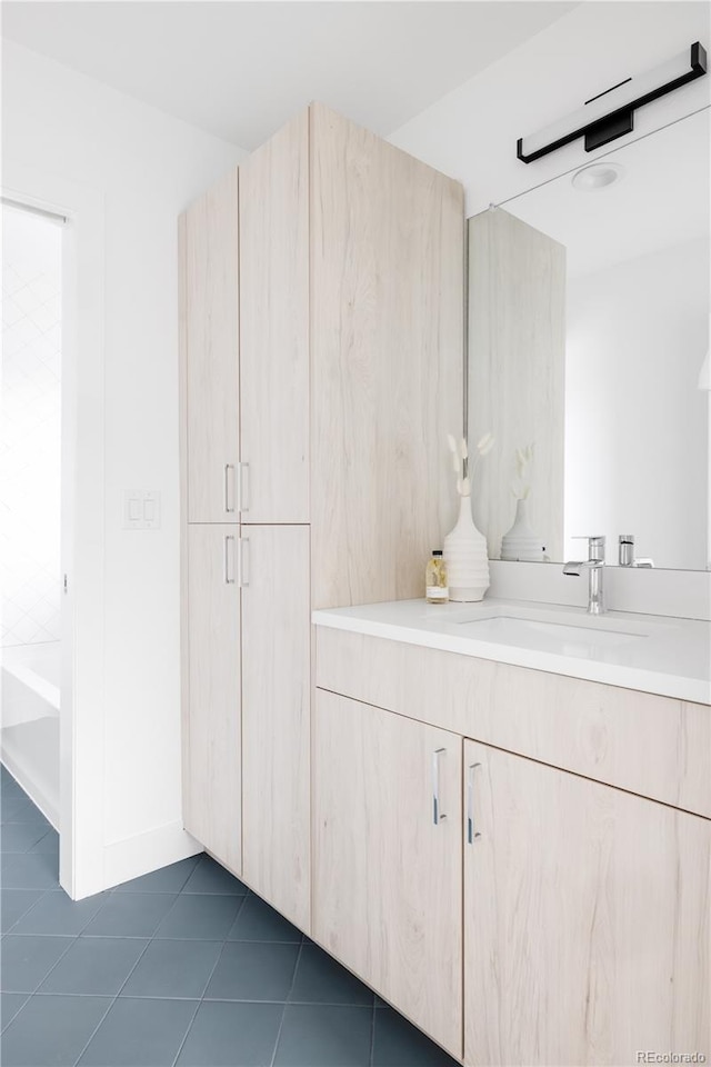 bathroom with vanity and tile patterned floors