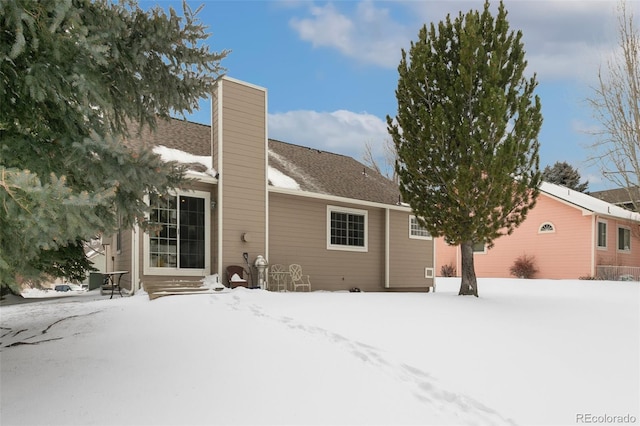 view of snow covered property